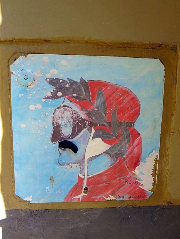 As often happens with street art, someone has added a mustache to Dante.